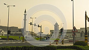 4K timelapse of traffic with clock tower in background, Doha, Qatar