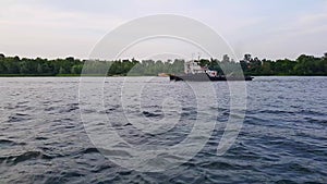 4K, two barges sails on the wide river of the Dnieper before the sunset