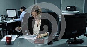 4K: Two female employees are working on her computers in a modern office.
