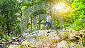 4k - Two young men running on rural offroad way during sunset or sunrise