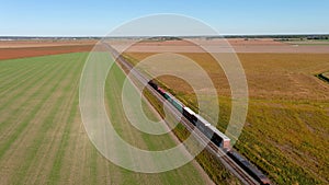 4K UHD drone aerial footage of a train in motion on countryside