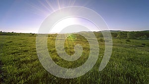 4K UHD mountain meadow timelapse at the summer. Clouds, trees, green grass and sun rays movement.