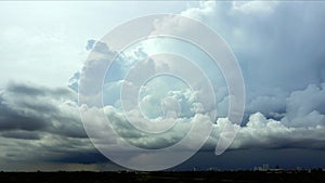 4k UHD time lapse, Cloudy white sky no flying birds, Below, there were clouds and rains over the city, Cumulonimbus clouds.