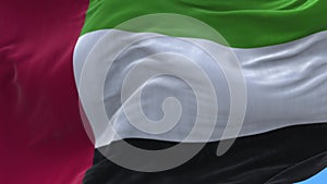 4k United Arab Emirates National flag wrinkles wind in UAE sky background.