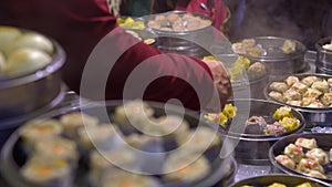 4K Vendor selling Dumpling and Shaomai in Asian Street Food Market of Taiwan