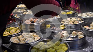 4K Vendor selling Dumpling and Shaomai in Asian Street Food Market of Taiwan