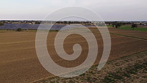 4k video aerial drone footage of solar panels in a field in Italy