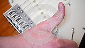 4k video of a close-up of a man`s hand raising the volume potentiometer