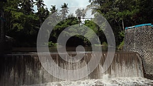 4k Video from drone of an old water dam for water supply of rice fields