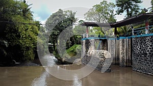 4k Video from drone of an old water dam for water supply of rice fields