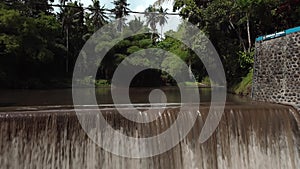 4k Video from drone of an old water dam for water supply of rice fields