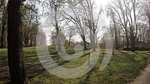 4k video of first person view cycling on cycle lane through park in the netherlands with classic architecture building as poi