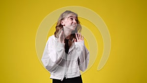 4k video of one girl laughing over pink background.