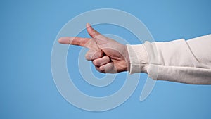 4k video of one man pointing at left and showing thumb up on blue background.