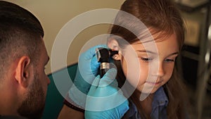 4k video otoscopy of child ears with otoscope. ENT doctor. Consultation with pediatric otolaryngologist. Treatment of