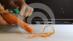 4K Video peeling a fresh carrott