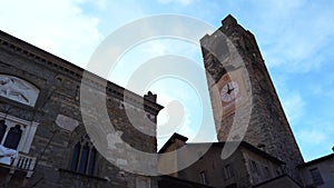 4k video Sky view of medieval clock Civic Tower of Campanone in Piazza Vecchia Bergamo, Italy