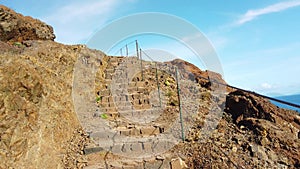 4K video walk on stone stairs on Madeira island, Portugal. From the cliffs is a beautiful view of the ocean waves. It is