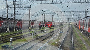 4k, view from the wet front window of a train locomotive to the railway