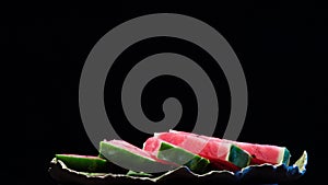 4k. Watermelon flesh close-up. the rotation of the watermelon on black background