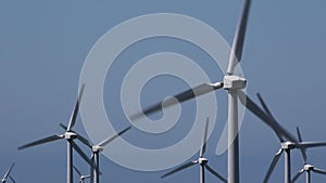 4K wind turbines against blue sky UK