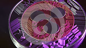 4K XRP ripple coin rotating close up dark background