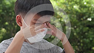 4k Young Asian boy wearing a face mask to protect virus