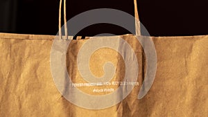 4k zoom in out Forest friendly bag Brown paper bag that is 100 recyclable and reusable spbd. Printed plea for user to