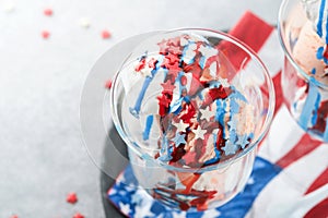 4th of July American Independence Day food or drink. Crazy milkshake with strawberry and vanilla ice cream white, blue, red colors