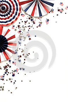 4th of July American Independence Day paper fans and confetti usa flag colors background top view, copy space.