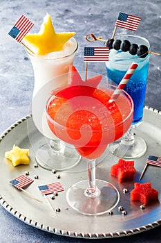 4th of July cocktails with a watermelon margarita in front.