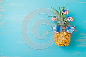 4th of July  creative concept with pineapple and American flag. Happy Independence Day background. Top view, flat lay