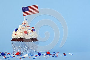 4th of July cupcake with flag, sprinkles