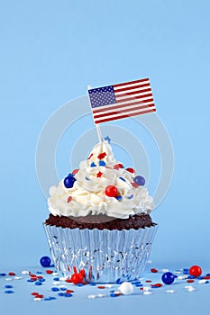 4th of July cupcake with flag, sprinkles