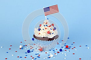 4th of July cupcake with flag, sprinkles