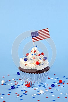 4th of July cupcake with flag, sprinkles