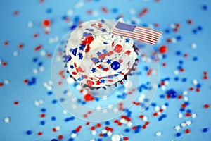 4th of July cupcake with flag, sprinkles