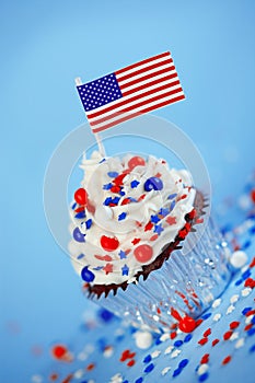 4th of July cupcake with flag, sprinkles