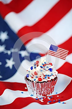 4th of July cupcake with flag, sprinkles