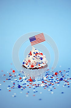 4th of July cupcake with flag, sprinkles