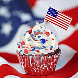 4th of July cupcake with flag, sprinkles