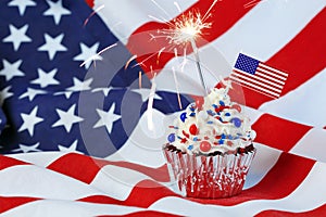 4th of July cupcake with flag, sprinkles