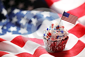 4th of July cupcake with flag and sprinkles