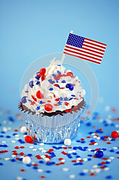 4th of July cupcake with flag and sprinkles