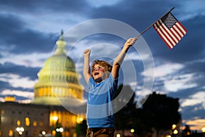 4th of July independence day in US. Kid boy with American USA flag 4th of July in Washington DC. American holiday 4th of