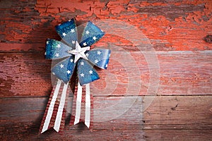 4th July patriotic badge on rustic wood