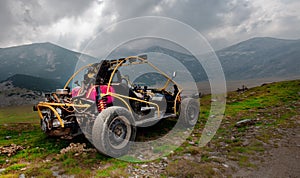 4wd buggy for extreme off-road shot on mountain photo