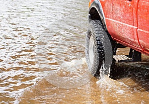 A 4wd truck on flooded road