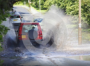 4x4 car driving through flood water