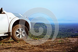 4x4 car on mountains valley backdrop